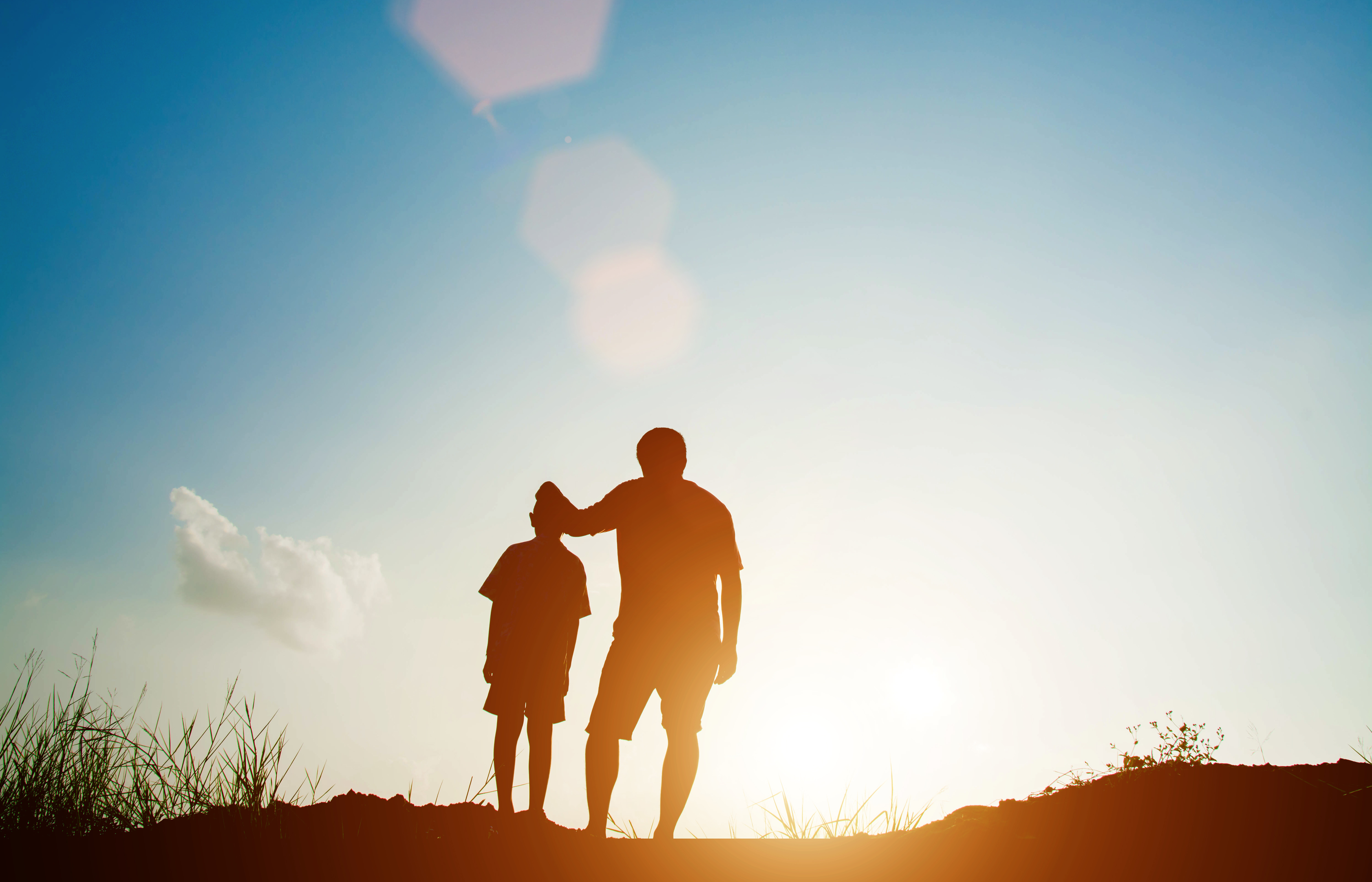 Father and son looking for future,  silhouette concept